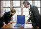 Mrs. Laura Bush is shown jewelry artifacts on her tour of the City of Stralsund Archives in Stralsund, Germany, Thursday, July 13, 2006, by Dr. Andreas Gruger, director of the Stralsund Museum of Cultural History. White House photo by Shealah Craighead