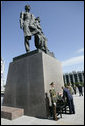 President George W. Bush and Laura Bush place a wreath at the Monument to the Heroic Defenders of Leningrad, Friday, July 14, 2006, in St. Petersburg, Russia, where President Bush will attend the G8 Summit. White House photo by Eric Draper