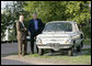 President George W. Bush and Russian President Vladimir Putin look over the first car owned by President Putin, a Zaporozhets, Friday, July 14, 2006, before they attend a social dinner at the Konstantinovsky Palace in Strelna, Russia. White House photo by Eric Draper