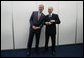 President George W. Bush and President Vladimir Putin of Russia, pose briefly for photographers before their joint press availability Saturday, July 15, 2006, during the G8 Summit in Strelna, Russia. White House photo by Eric Draper