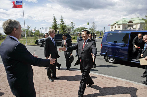 President George W. Bush welcomes President Hu Jintao of the People's Republic of China for a meeting at the G8 Summit in Strelna, Russia, Sunday, July 16, 2006. "The United Nations Security Council unanimously passed a resolution dealing with the North Korean issue, and I want to thank you for your leadership on that, Mr. President," said President Bush. "We're working together on the Iranian issue. We talked about the Middle East. I want to thank you very much for our continued dialogue on bilateral issues. White House photo by Eric Draper