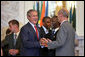 President George W. Bush talks with South African President Thabo Mbeki, center, and World Trade Organization Chief Pascal Lamy during the G8 Summit at Konstantinvosky Palace in Strelna, Russia, Monday, July 17, 2006. White House photo by Paul Morse