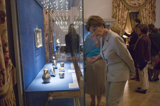 Laura Bush looks over a display piece Monday, July 17, 2006, at a Hermitage Exhibit for G8 spouses at the Konstantinovsky Palace Complex in Strelna, Russia, site of the 2006 G8 Summit that ended Monday. White House photo by Shealah Craighead