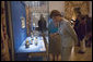 Laura Bush looks over a display piece Monday, July 17, 2006, at a Hermitage Exhibit for G8 spouses at the Konstantinovsky Palace Complex in Strelna, Russia, site of the 2006 G8 Summit that ended Monday. White House photo by Shealah Craighead