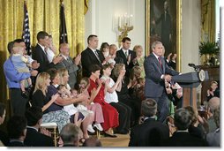 President George W. Bush delivers remarks about stem cell research policy legislation in the East Room Wednesday, July 19, 2006. "Each of these children was adopted while still an embryo, and has been blessed with the chance to grow up in a loving family," said the President of children sharing the stage with him. "These boys and girls are not spare parts. They remind us of what is lost when embryos are destroyed in the name of research." White House photo by Kimberlee Hewitt