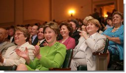 Mrs. Laura Bush applauds the speakers participating in the National Endowment for the Arts ‘Big Read’ event Thursday, July 20, 2006, at the Library of Congress in Washington. The ‘Big Read’ is a new program to encourage the reading of classic literature by young readers and adults.  White House photo by Shealah Craighead