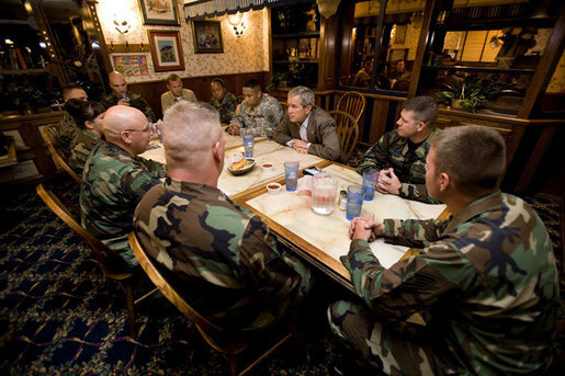 President George W. Bush meets with U.S.military service personnel who have recently returned from duty in Iraq and Afghanistan to hear about their experiences Friday, July 21, 2006, at Tamale Fiesta Kitchen restaurant in Aurora, Colorado. White House photo by Eric Draper