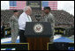 Vice President Dick Cheney administers the Ceremonial Oath of Re-enlistment of Corporal Jarrod Fields, at a rally for the troops at Fort Stewart, Ga., Friday, July 21, 2006. Cpl. Fields was wounded by an improvised explosive device in 2005 while serving in Iraq with the 3rd Infantry Division. White House photo by David Bohrer