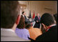 President George W. Bush and Iraqi Prime Minister Nouri al-Maliki take questions from reporters at a joint press availability in the East Room of the White House Tuesday, July 25, 2006, where they answered questions on security in Iraq and the ongoing crisis in Lebanon. White House photo by David Bohrer