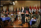 President George W. Bush listens as Iraqi Prime Minister Nouri al-Maliki speaks to military personnel and their families during his visit to Fort Belvoir, Va., Wednesday, July 26, 2006. White House photo by Paul Morse