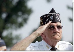 A Korean War veteran salutes during the singing of the National Anthem, Thursday, July 27, 2006 during the 2006 Korean War Veterans Armistice Day Ceremony held at the Korean War Memorial in Washington, D.C. Vice President Dick Cheney honored the veterans in an address and remembered fallen soldiers in a wreath laying ceremony at the memorial.  White House photo by David Bohrer