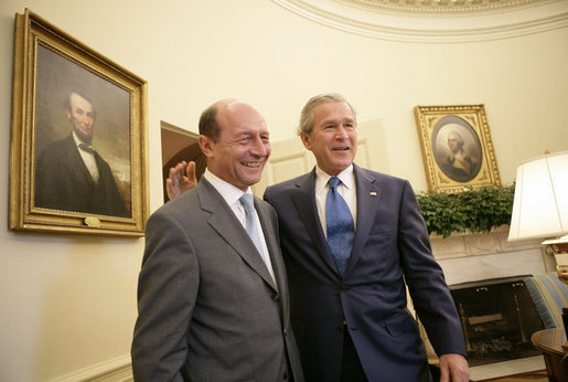 President George W. Bush welcomes Romanian President Traian Basescu to the Oval Office at the White House Thursday, July 27, 2006 in Washington, D.C. White House photo by Eric Draper