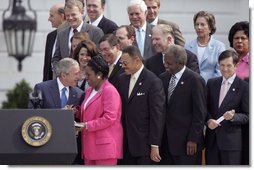 President George W. Bush talks with U.S. Representative Sheila Jackson Lee, D-Texas, during the signing of H.R. 9, the Fannie Lou Hamer, Rosa Parks, and Coretta Scott King Voting Rights Act Reauthorization and Amendments Act of 2006, on the South Lawn Thursday, July 27, 2006.  White House photo by Paul Morse