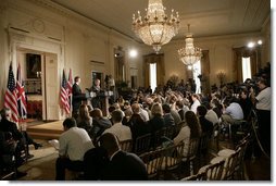 President George W. Bush is joined by Prime Minister Tony Blair of the United Kingdom as he answers a reporter’s question during a joint press availability Friday, July 28, 2006, in the East Room of the White House.  White House photo by Eric Draper