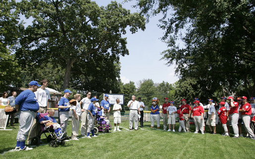 President George W. Bush welcomes players and guests to the White House Sunday, July 30, 2006, for the Tee Ball on the South Lawn game between the Thurmont Little League Civitan Club of Frederick Challengers of Thurmont, Md., and the Shady Spring Little League Challenger Braves of Shady Spring, W. Va. White House photo by Paul Morse