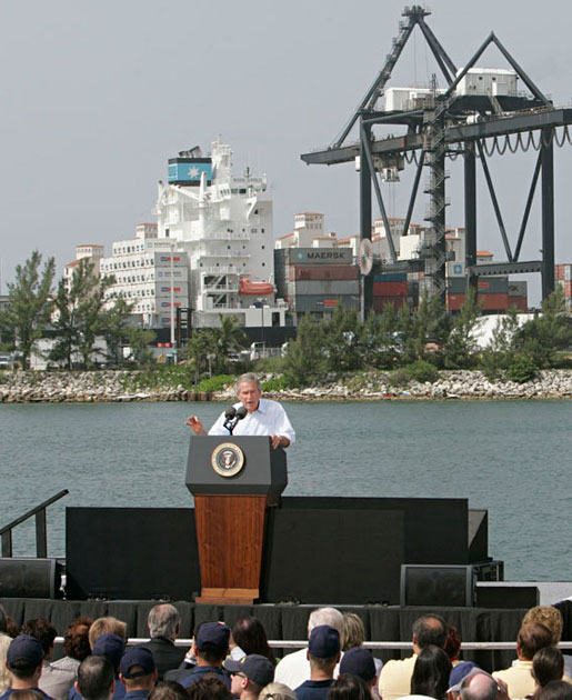 President George W. Bush addresses an audience on America's economy at the U.S. Coast Guard Integrated Support Command at the Port of Miami Monday, July 31, 2006. "It's an honor to be here at the largest container port in Florida and one of the most important ports in our nation," said President Bush. "From these docks, ships loaded with cargo deliver products all around the world carrying that label "Made in the USA."' White House photo by Kimberlee Hewitt