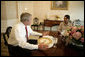 President George W. Bush meets with U.S. Secretary of State Condoleezza Rice at the White House Monday evening, July 31, 2006, to discuss her recent trip to the Middle East. White House photo by Eric Draper