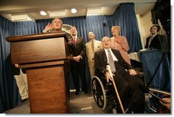 Sharing the stage with several White House Press Secretaries, President George W. Bush jokes with reporters in the James S. Brady Press Briefing Room Wednesday, August 2, 2006. It was the last press briefing before the room undergoes extensive renovations. Pictured at the President’s right is Press Secretary James S. Brady, who was wounded during an assassination attempt on President Reagan. The room is named in his honor.  White House photo by Eric Draper