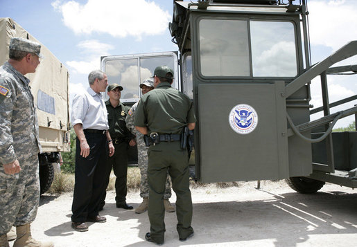 President George W. Bush speaks with members of the National Guard and U.S. Border Patrol officers during his tour along the U.S.-Mexico border Thursday, Aug. 3, 2006, in the Rio Grande Valley border patrol sector in Mission, Texas. White House photo by Eric Draper