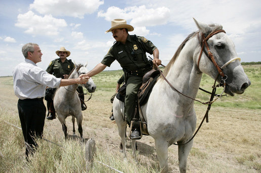 President George W. Bush meets with mounted U.S. Border Patrol agents along the U.S.-Mexico border Thursday, Aug. 3, 2006, in the Rio Grande Valley border patrol sector in Mission, Texas. White House photo by Eric Draper