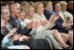 Mrs. Laura Bush, joined by, from left, Robert D. Coombe, Ph.D., Chancellor, University of Denver, Jordan Suniga, Student, Grace Keirnes, Student, and Lt. Governor Jane E. Norton, Lt. Governor of Colorado, attends the second regional Helping America's Youth Conference on Friday, August 4, 2006, in Denver, Colorado. According to the Department of Defense there are approximately 189, 000 children of deployed parents nationwide. White House photo by Shealah Craighead