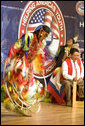 A member of The Seven Falls Indian Dancers performs during the second regional Helping America's Youth Conference on Friday, August 4, 2006, in Denver, Colorado. The dancers are from the Pawnee, Flandreau Santee-Sioux Crow Creek Sioux, and Cheyenne River Sioux tribes. The troupe has been dancing throughout Colorado for over 25 years. White House photo by Shealah Craighead