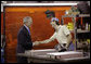 President George W. Bush speaks with a metal worker Thursday, Aug. 10, 2006, during his tour and visit with employees at Fox Valley Metal-Tech in Green Bay, Wis. White House photo by Eric Draper