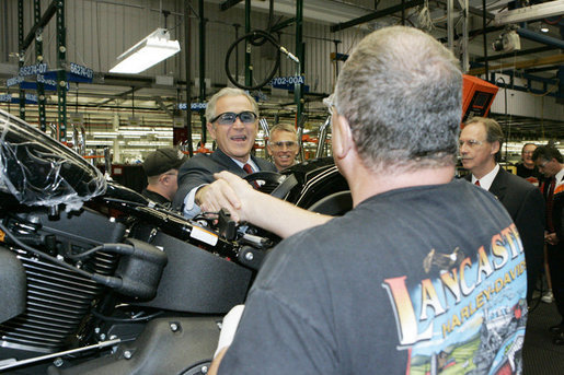 President George W. Bush meets workers along the assembly line during a tour of the Harley-Davidson Vehicle Operations facility Wednesday, Aug. 16, 2006 in York, Pa., where he participated in a roundtable discussion on the economy. White House photo by Kimberlee Hewitt