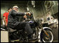 President George W. Bush sits on a motorcycle at the roll test section of the assembly line at the Harley-Davidson Vehicle Operations facility Wednesday, Aug. 16, 2006 in York, Pa., where President Bush also participated in a roundtable discussion on the economy. White House photo by Kimberlee Hewitt