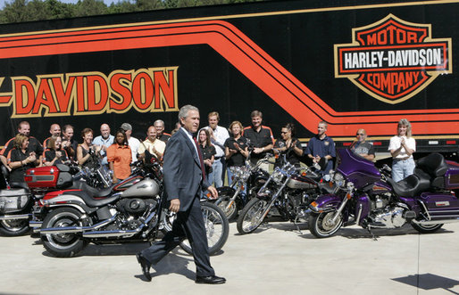 President George W. Bush is applauded as he arrives to deliver his remarks on the economy following his tour of the Harley-Davidson Vehicle Operations facility Wednesday, Aug. 16, 2006, in York, Pa. White House photo by Kimberlee Hewitt