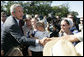 President George W. Bush meets with Amish and Mennonite residents Wednesday, Aug. 16, 2006 in Lancaster, Pa., upon his arrival aboard Marine One. White House photo by Kimberlee Hewitt