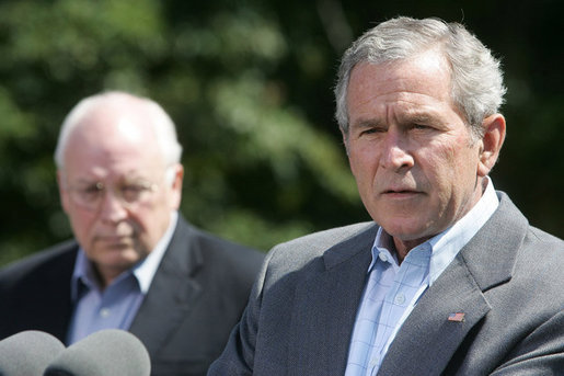 President George W. Bush talks to reporters Friday, Aug. 18, 2006 in Camp David, Md., following a meeting with his economic advisors and Vice President Dick Cheney, seen background. President Bush said the foundation of our economy is strong and is maintaining solid growth. White House photo by David Bohrer