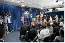 President George W. Bush gestures as he thanks the White House media for its hospitality Monday, Aug. 21, 2006, at the start of a news conference in the temporary press briefing room at the White House Conference Center. "Fancy digs you got here," the President told the gathering. "It's good to visit with you." White House photo by Paul Morse