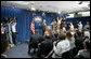 President George W. Bush gestures as he thanks the White House media for its hospitality Monday, Aug. 21, 2006, at the start of a news conference in the temporary press briefing room at the White House Conference Center. "Fancy digs you got here," the President told the gathering. "It's good to visit with you." White House photo by Paul Morse