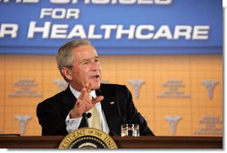 President George W. Bush participates in a panel discussion Tuesday, Aug. 22, 2006, at the Minneapolis Marriott Southwest in Minnetonka, Minn., to offer perspectives on efforts to enhance health care transparency and move towards a value-based health care competition. White House photo by Paul Morse