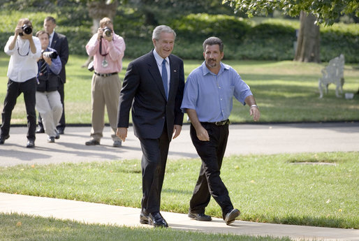 President George W. Bush and Rockey Vaccarella of New Orleans walk to the Oval Office after delivering a joint statement to the press on the South Lawn Wednesday, Aug. 23, 2006. Vaccarella, who lost his home in the wake of Hurricane Katrina, drove to Washington, D.C., with the hopes of speaking directly with President Bush. White House photo by Paul Morse