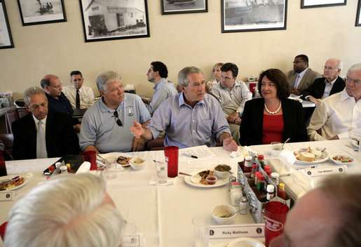 President George W. Bush is joined by Mississippi Governor Haley Barbour, left, as they attend a working luncheon with Mississippi community and housing officials at the Biloxi Schooner Restaurant to discuss the state’s recovery and rebuilding efforts Monday, Aug. 28, 2006 in Biloxi, Miss., on the one-year anniversary of Hurricane Katrina. White House photo by Eric Draper