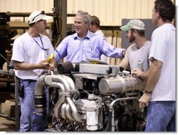 President George W. Bush visits workers at the United States Marine, Inc. boat manufacturing facility in Gulfport, Miss., Monday, Aug. 28, 2006, as part of the President’s two-day tour of the Gulf Coast region to assess the progress of the area’s recovery and rebuilding efforts following the devastation of Hurricane Katrina in 2005. White House photo by Eric Draper