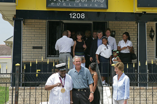 President George W. Bush, Laura Bush and legendary Fats Domino talk to the press after the President presented him the National Medal of Arts Tuesday, Aug. 29, 2006, at the musician's home in the Lower 9th Ward of New Orleans. The medal was a replacement medal for the one -- originally awarded by President Bill Clinton -- that was lost in the flood waters of Hurricane Katrina. White House photo by Shealah Craighead