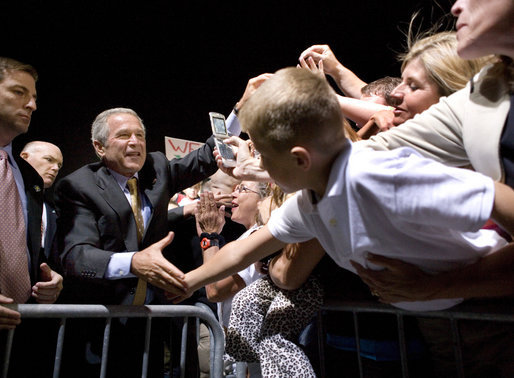 President George W. Bush greets the crowd during an airport welcome at the Utah Air National Guard in Salt Lake City, Utah, Wednesday, Aug. 30, 2006. Nearly 2000 local residents and base personnel turned out to welcome the President. "For those of you with loved ones in the United States military, I thank you from the bottom of my heart, said President Bush in his remarks. "I can't tell you how proud I am to be the Commander-in-Chief of such a fantastic group of young men and women." White House photo by Eric Draper