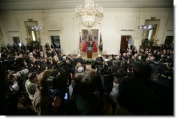 President George W. Bush addresses invited guests, members of the media and White House staff Wednesday. Sept. 6, 2006 in the East Room of the White House, as he discusses the administration's draft legislation to create a strong and effective military commission to try suspected terrorists. The bill being sent to Congress said President Bush, "reflects the reality that we are a nation at war, and that it is essential for us to use all reliable evidence to bring these people to justice." White House photo by Kimberlee Hewitt