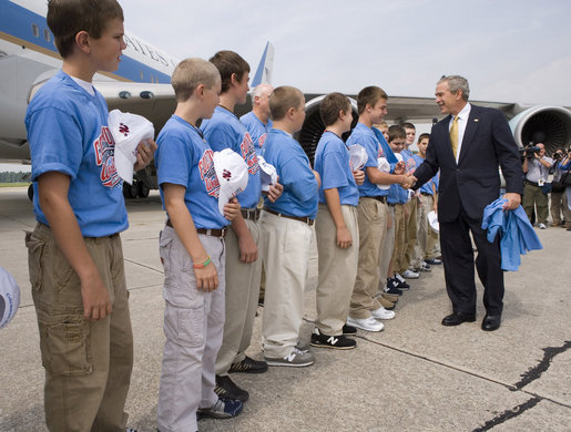 President George W. Bush congratulates members of the Columbus Northern Little League Team on winning the 2006 Little League Baseball World Series Championship at Dobbins Air Reserve Base in Marietta, Ga., Thursday, Sept. 7, 2006. White House photo by Eric Draper