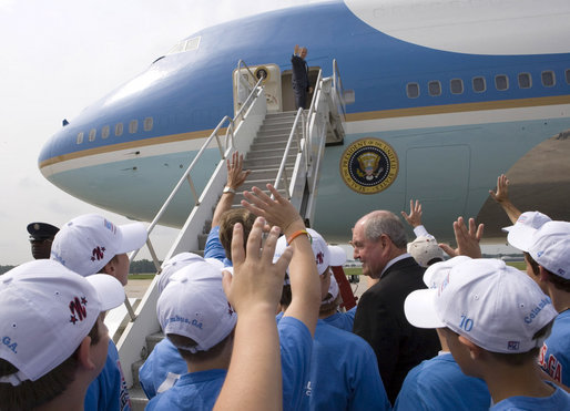 President George W. Bush waves to Georgia Governor Sonny Perdue and the Columbus Northern Little League Team at Dobbins Air Reserve Base in Marietta, Ga., Thursday, Sept. 7, 2006. The team defeated the Kawaguchi Little League of Japan, 2 to 1, to win the 2006 Little League Baseball World Series Championship on August 28 in Williamsport, Pa. It is the second consecutive year that an American team has won the world series title. White House photo by Eric Draper