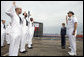 Mrs. Laura Bush observes a U.S. Navy Re-enlistment Ceremony Saturday, September 9, 2006, as Rear Admiral Fox, Director, White House Military Office, administers the oath to sailors prior to the Commissioning Ceremony of the USS Texas in Galveston, Texas. White House photo by Shealah Craighead