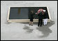 To commemorate the fifth anniversary of the terrorist attacks on September 11, 2001, President George W. Bush and Laura Bush lay a wreath in the south tower reflecting pool at the World Trade Center site in New York City Sunday, September 10, 2006. White House photo by Eric Draper