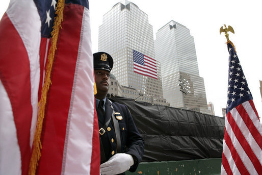 A police officer stands at attention at Ground Zero during the ceremonies marking the fifth anniversary of the September 11th terrorist attacks in New York City Sunday, September 10, 2006. White House photo by Eric Draper