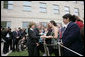 After placing a memorial wreath at the Pentagon, the President and Laura Bush greet audience members Monday, Sept. 11, 2006, during ceremonies marking the fifth anniversary of the September 11th attacks. White House photo by Eric Draper