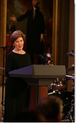 Mrs. Laura Bush welcomes guests to the East Room for entertainment Thursday night, Sept. 14, 2006, during the Thelonious Monk Institute of Jazz dinner at the White House. White House photo by Shealah Craighead