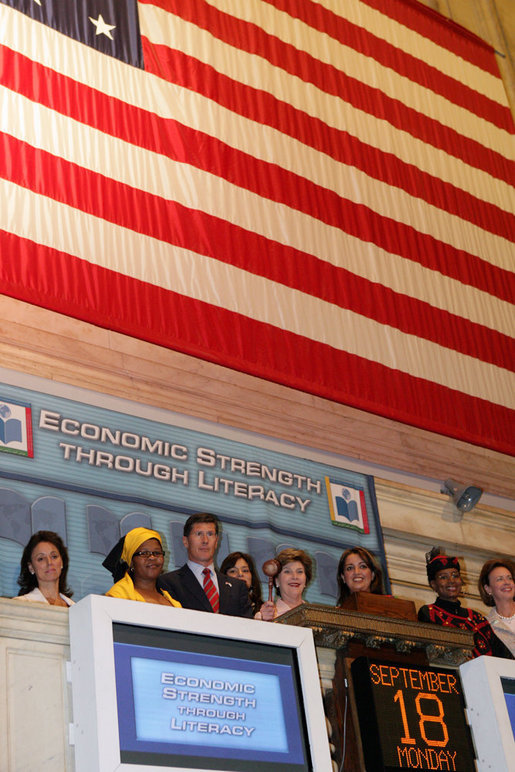 Mrs. Laura Bush raises the gavel signaling the close of trading Monday, Sept. 18, 2006, at the New York Stock Exchange. Mrs. Bush visited the Exchange to highlight literacy's role in extending benefits of free enterprise to individuals around the world. White House photo by Shealah Craighead