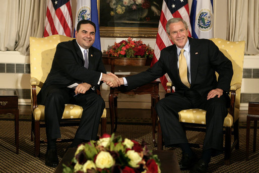 President George W. Bush exchanges handshakes with El Salvador's President Elias Antonio Saca at the start of their bilateral meeting Monday, Sept. 18, 2006, at New York's Waldorf-Astoria Hotel. White House photo by Eric Draper